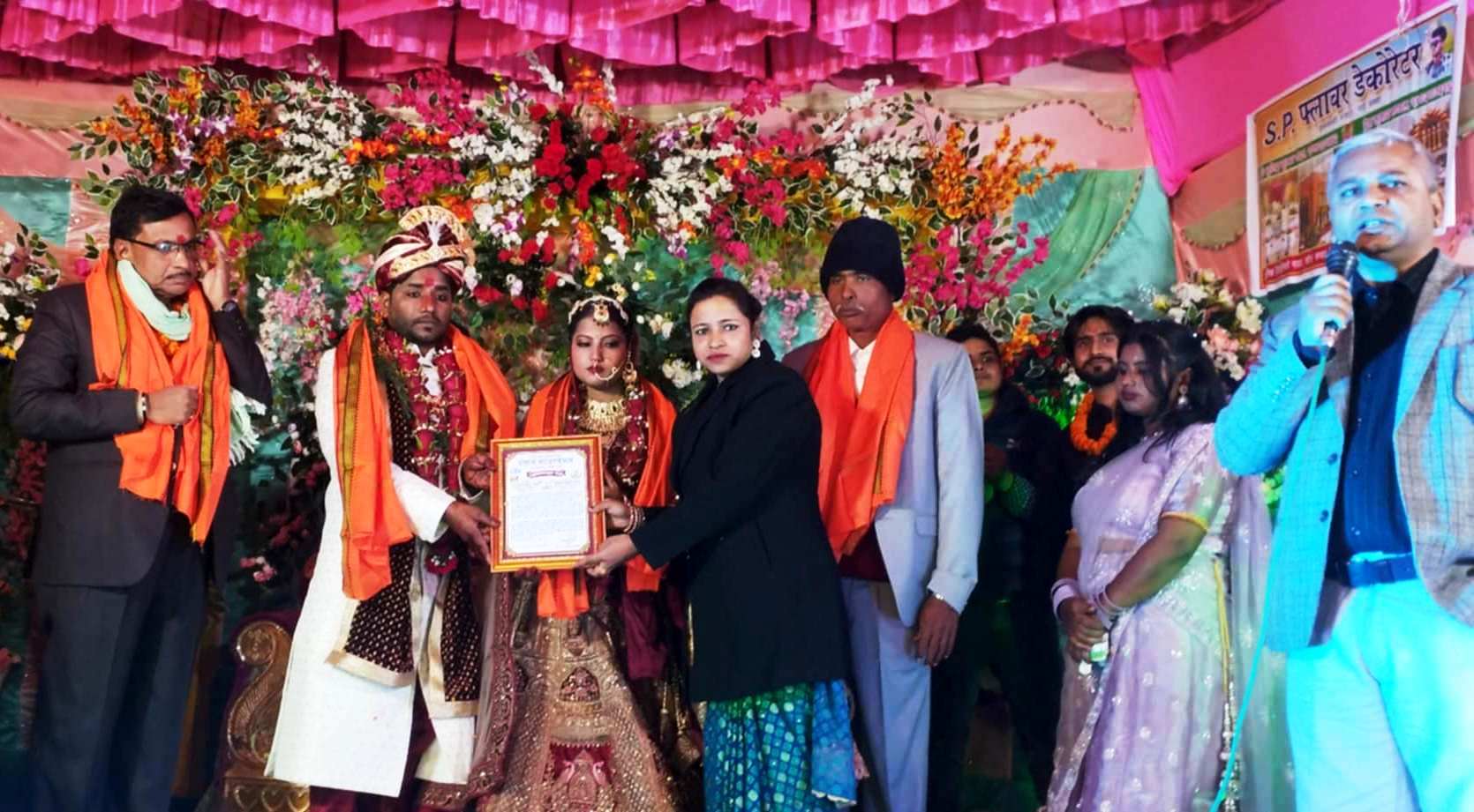 Dalan Foundation Chairperson Anju Yadav honoring the couple Dr. Pankaj Yadav and Kopila Kumari Yadav (BSc Nursing) for marrying without dowry.